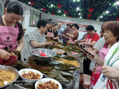 杨汛桥街道新时代文明实践-建吴居庆祝端午包粽子活动